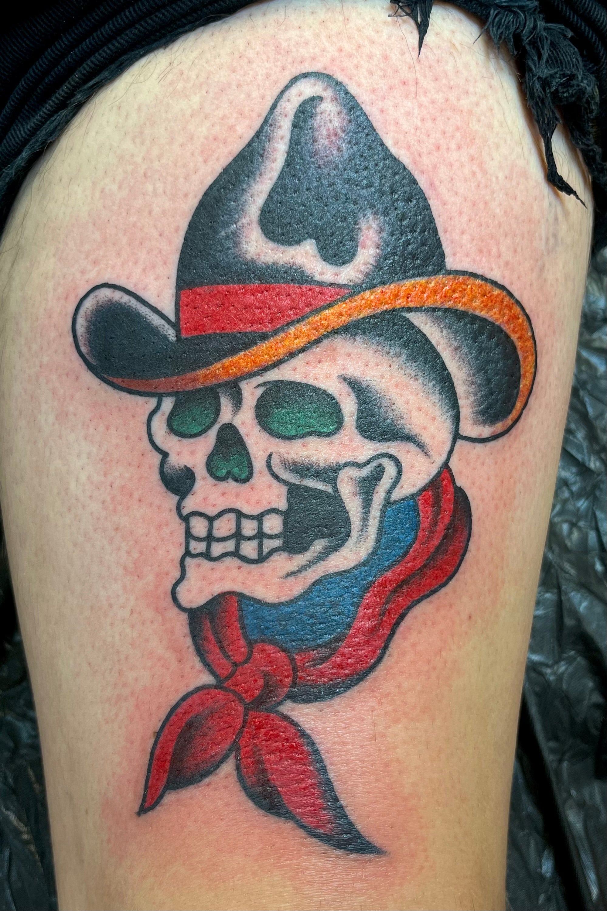Bold American traditional classic Tony polito cowboy skull tattoo in colour. Tattooed in London