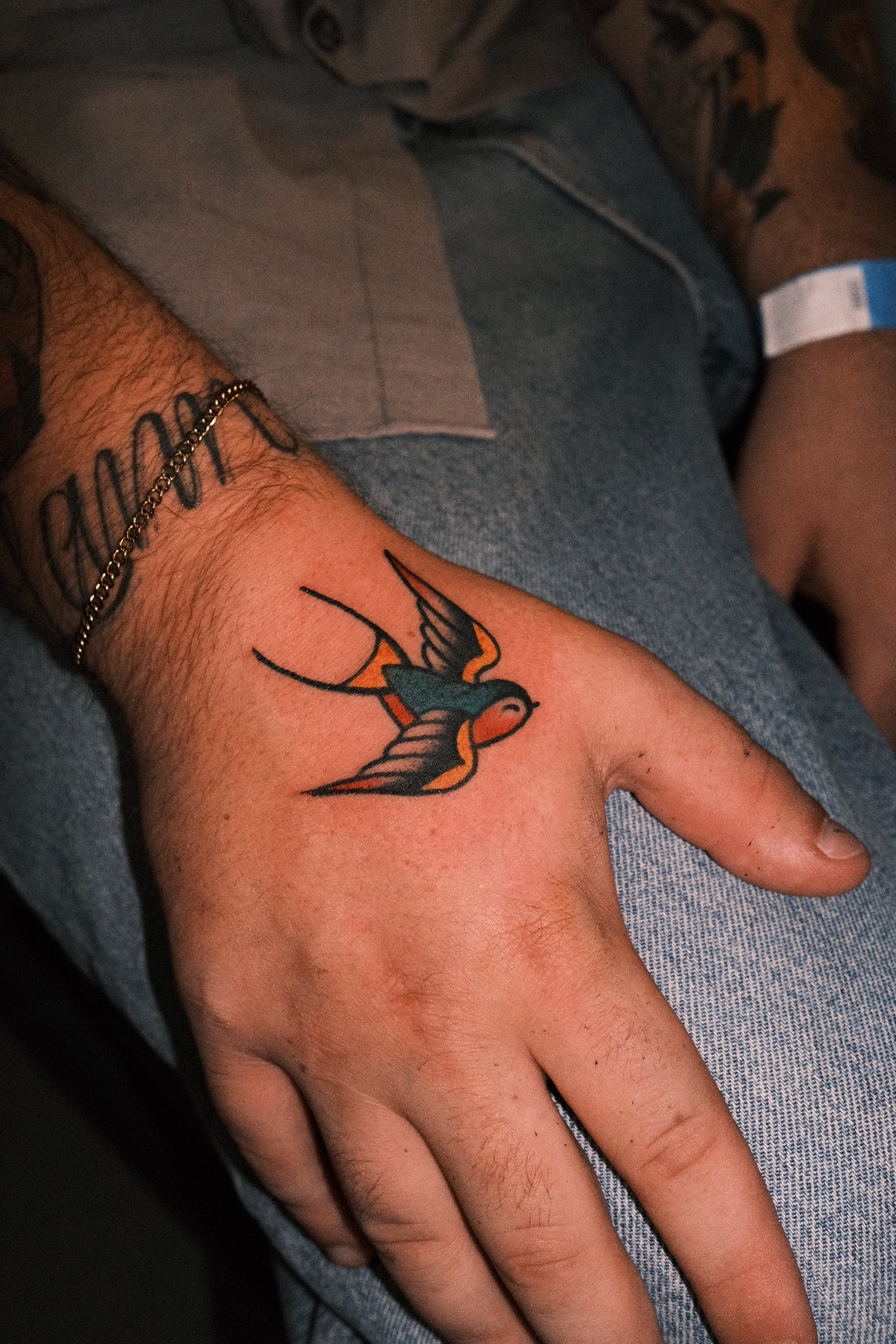 Bold American traditional classic swallow hand tattoo in colour. Done in London by jake cordal at frith street tattoo