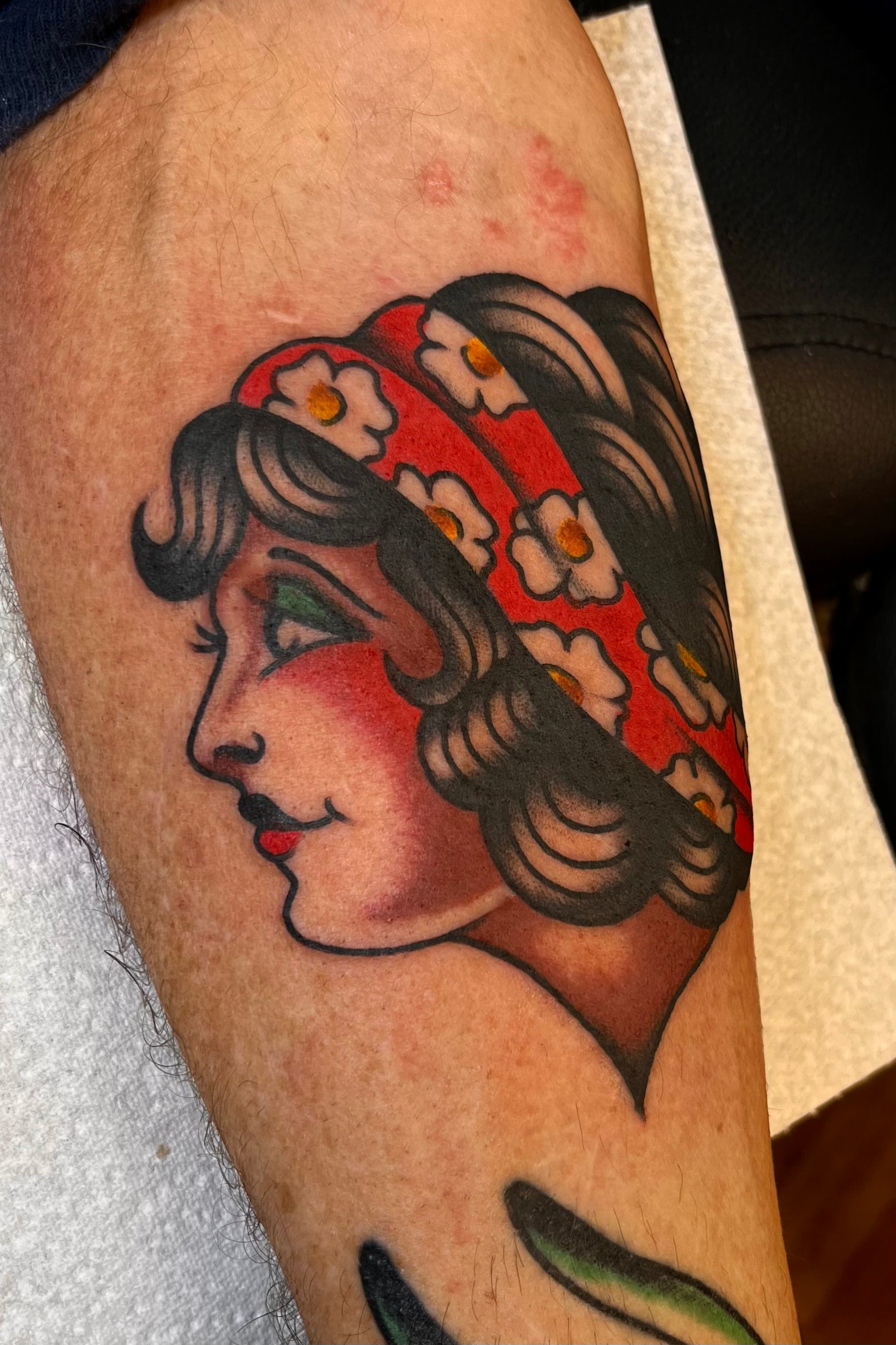 Colourful Bold American traditional classic girl head gypsy tattoo. Done in London